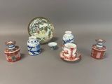 a lot of small vases and a plate on the table