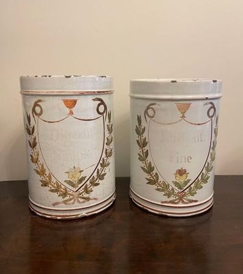 two tins that are sitting on a table
