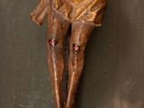 wooden crucifix of jesus hanging on a wall in a church