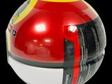 an image of a red and yellow ball with a black stripe around it