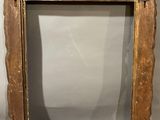 an old wooden frame with a crown on top of it