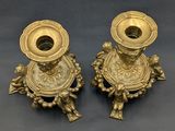 pair of antique brass candlesticks with angels and flowers