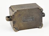 an image of a small bronze box with a handle on a white background