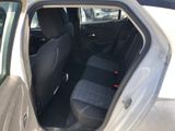 the back seat of a car with the door open and the door open