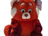 a stuffed animal that is sitting on a white surface