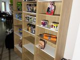 many shelves in the room with various items on them