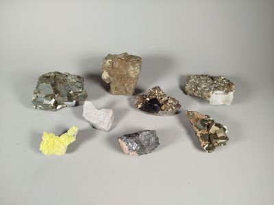 several different types of rocks and stones on a white surface