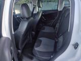 the interior of a small white car with black leather seats