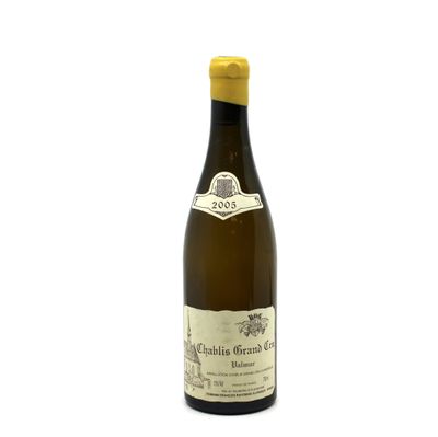a bottle of wine that is sitting on a table