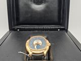an image of a watch sitting in a black box on a table