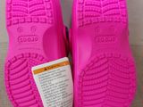 a close up of a pair of pink children ' s shoes