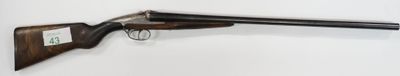 a close up of a rifle mounted on a wall