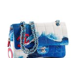 a white and blue handbag with a red anchor on it