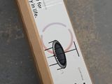 a box that is sitting on the ground next to a skateboard