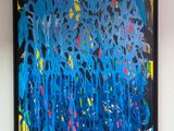 a painting hanging on the wall of a room