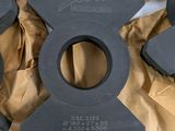 four pieces of black plastic on top of a brown bag