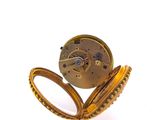 a gold pocket watch with a chain attached to it