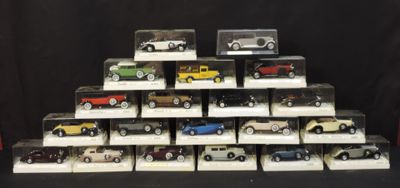 a lot of toy cars on display in a display case
