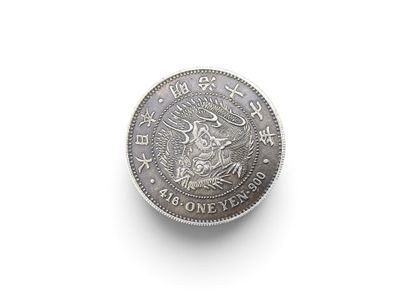 a close up of a coin on a white surface with a white background