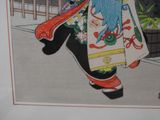 a picture of a woman walking down the street