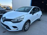 a white car parked in front of a garage