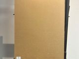 an easel with a piece of cardboard sitting on top of it