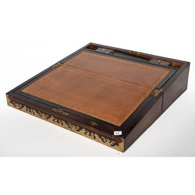 a large wooden tray with a leather top and brass trimming