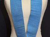 an image of a mannequin with a blue sash and a red rose on it