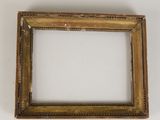 an old picture frame on a white surface with a white background