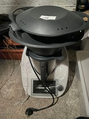 an image of a black and white blender with a lid on it