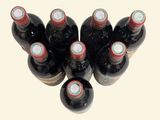 six bottles of wine sitting next to each other on a table