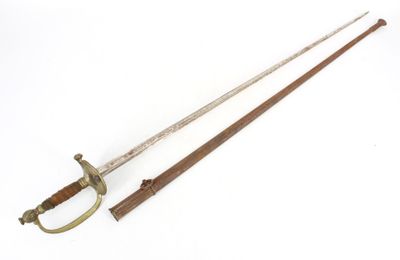 an old sword with a wooden handle on a white surface