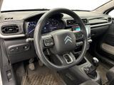 the interior of a car with a steering wheel and dashboard controls