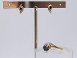 a ring and a ring holder on a glass stand