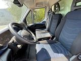 the interior of a van with two seats and a steering wheel