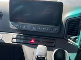 a dashboard of a car with a digital display on it