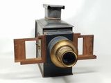 an old camera that is sitting on a table