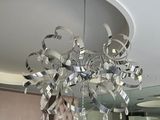 a chandelier hanging from the ceiling in a room