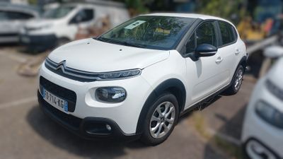 a picture of a white car parked in a parking lot