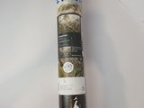 a roll of yoga mat on a table with a dog on it