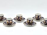 six blue and white cups and saucers sitting on top of each other
