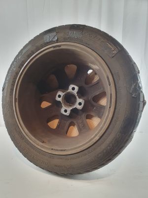 a close up of a tire on a white surface