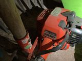 an image of a chainsaw and a pole on the ground