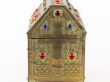 an image of a gold box with colorful jewels on it