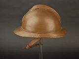 an old helmet on a stand on a black background
