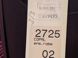 a close up of a label on a jacket on a hanger