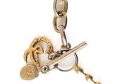a gold chain with a key and a keychain attached to it