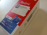 a box of redmi tape on a table next to a laptop