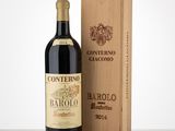 a bottle of wine sitting next to a wooden box