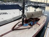 a sail boat that is docked in the water